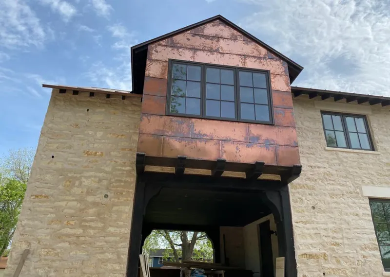 Copper metal panel facade on a stone building for Metal Roof Coating in Waianae