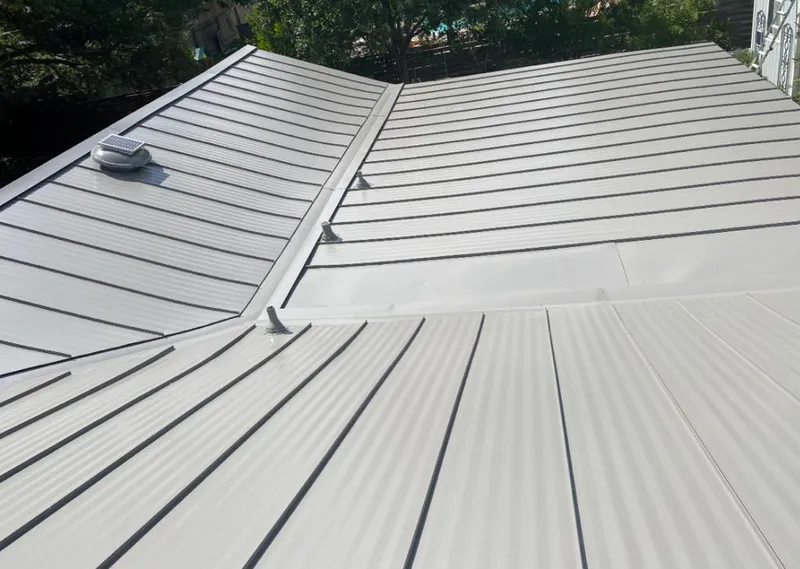 Solar attic fan installed on a metal roof for Roof Ventilation in Waianae
